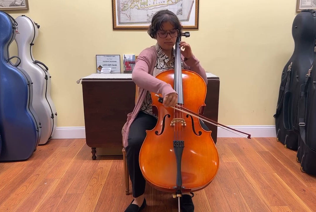 Erica giving a cello a whirl